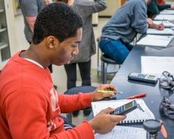 student working on chemistry problem