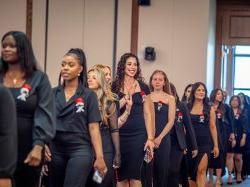 Nursing graduates processing to their seats at the Pinning Ceremony.